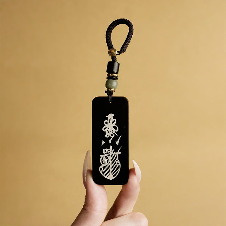 Ebony keychain with talisman