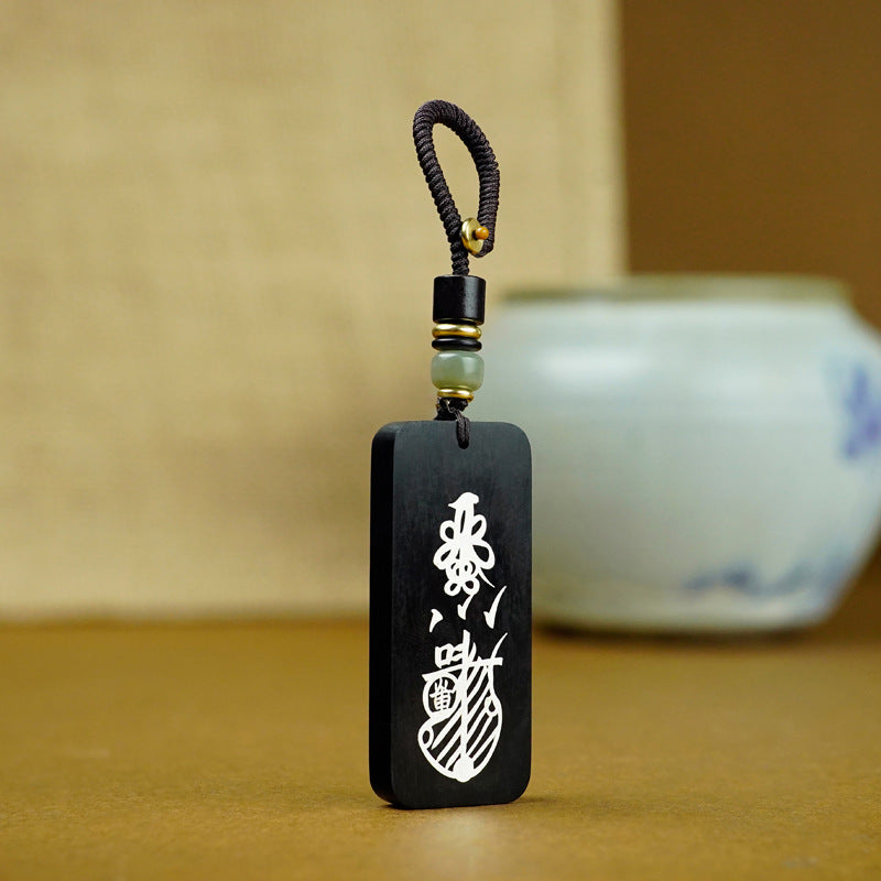 Ebony keychain with talisman