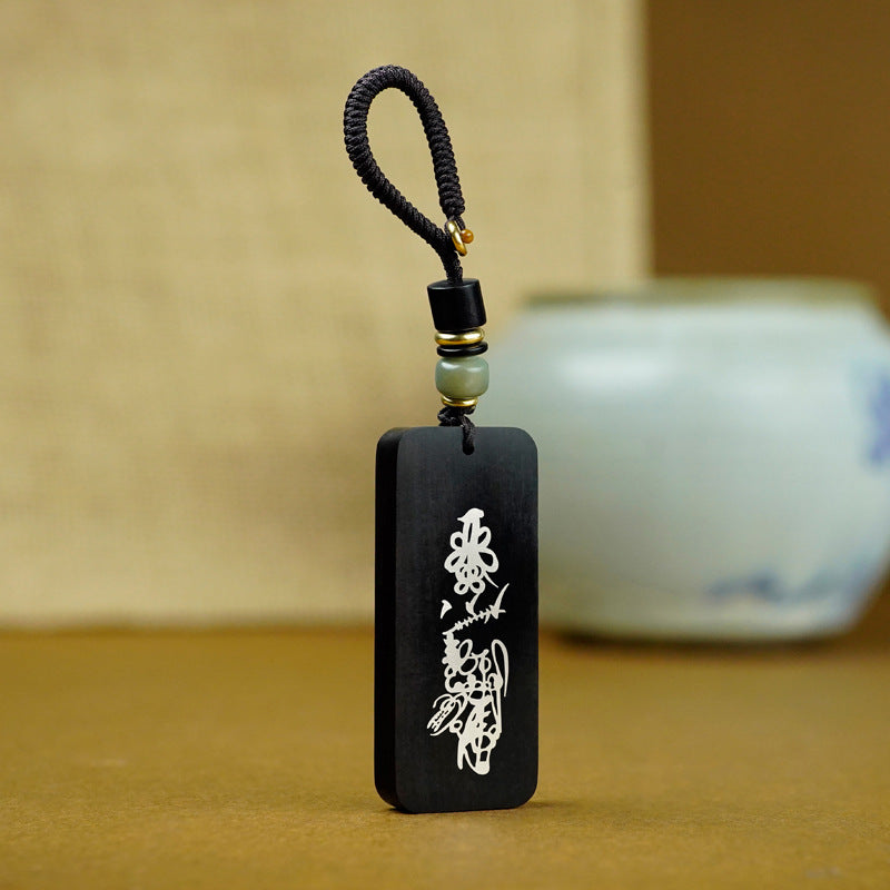 Ebony keychain with talisman